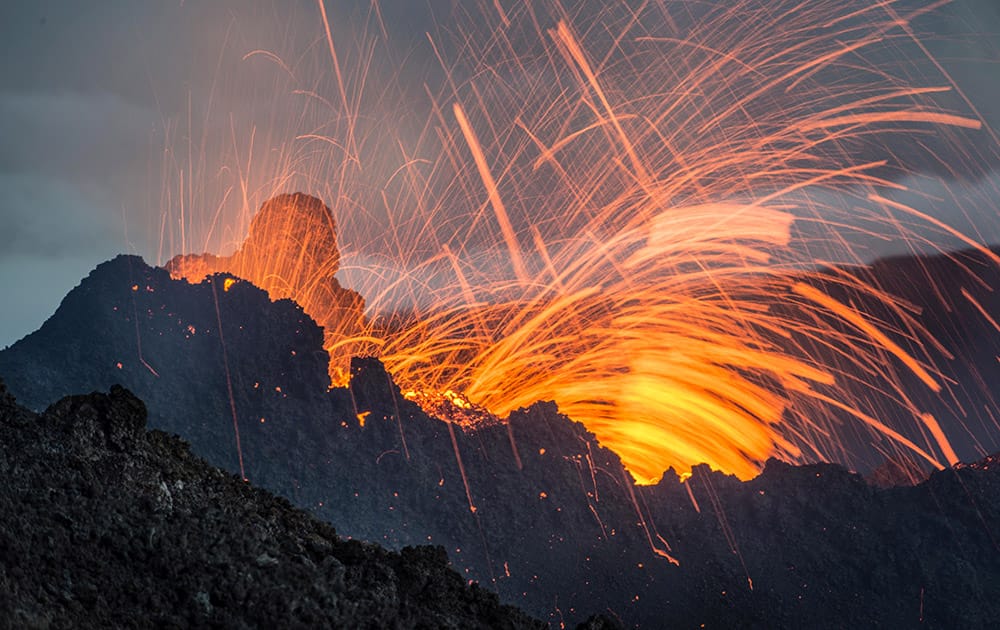 Lava erupts from the Piton de la Fournaise volcano, in the French Indian Ocean island of La Reunion. This is the second eruption in the past year at Piton de la Fournaise after 3-years of quiet. 