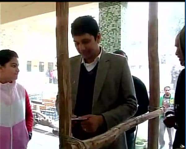 AAP candidate from GK Saurabh Bharadwaj waits outside polling booth to cast his vote #DelhiVotes -twitter
