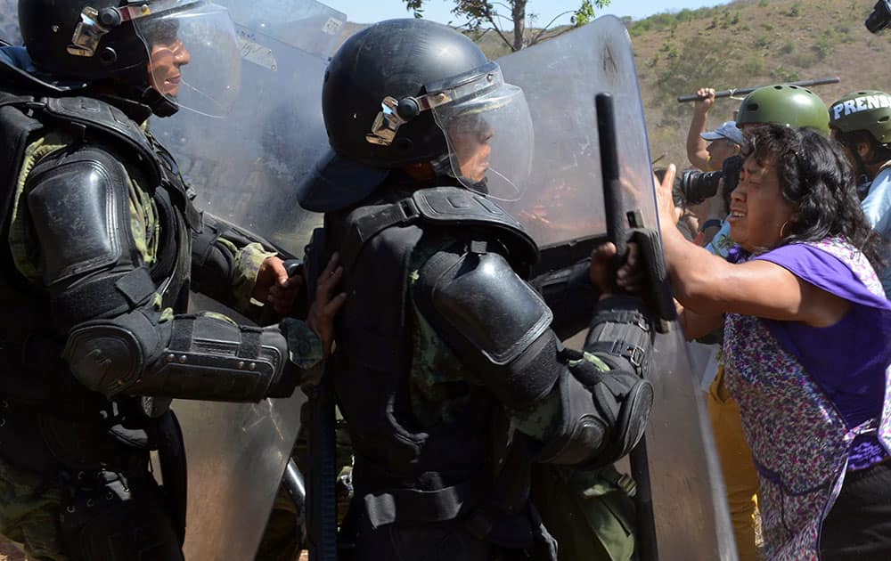Residents battle with Mexican army military police in a neighborhood in the city of Chilpancingo, Mexico.