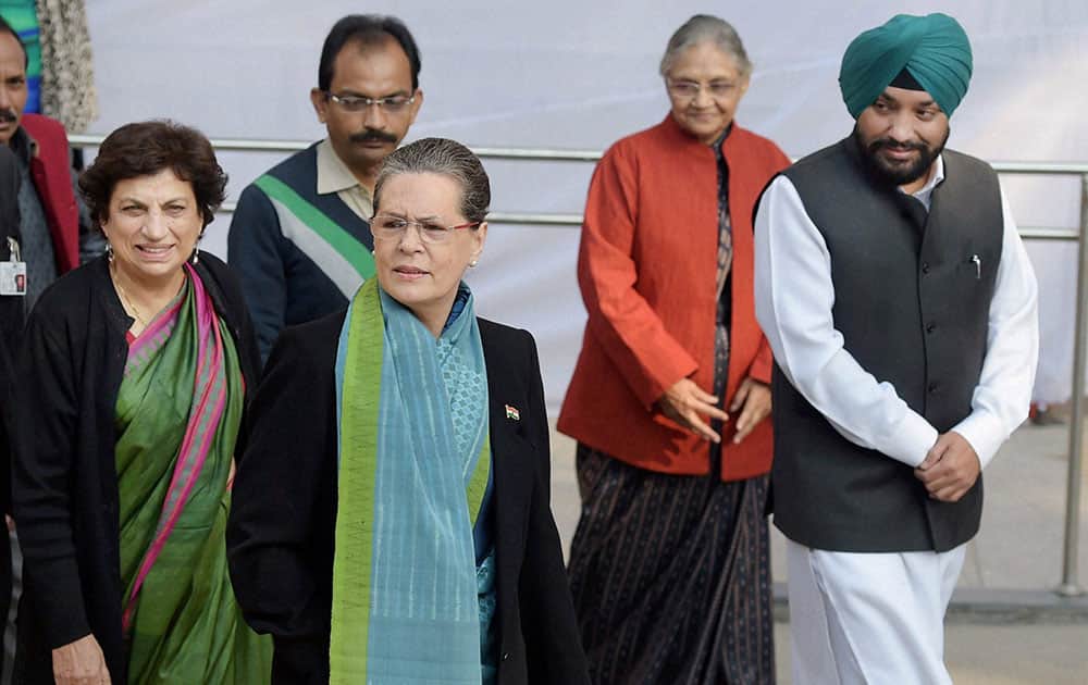Congress President Sonia Gandhi along with party leaders Kiran Walia, Arvinder Singh Lovely and Sheila Dikshit after casting her vote for the Assembly elections, at Nirman Bhavan in New Delhi.