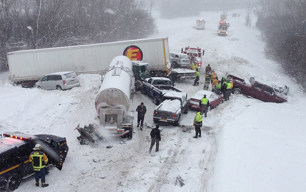 Cars and tracker trailers are tangled up after a huge pileup along Interstate 81, near Sandy Creek, N.Y. Troopers say the northbound lanes of the highway are closed from Exit 37 in the village of Sandy Creek to Exit 40 in the Town of Ellisburg due to heavy lake-effect snow. 