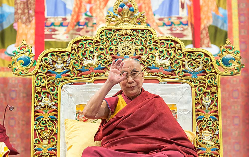 His Holiness the Dalai Lama speaks during Buddhist teachings in the St. Jakobshalle in Basel, Switzerland