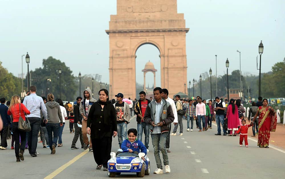 People enjoying an evening at the India gate in New Delhi.