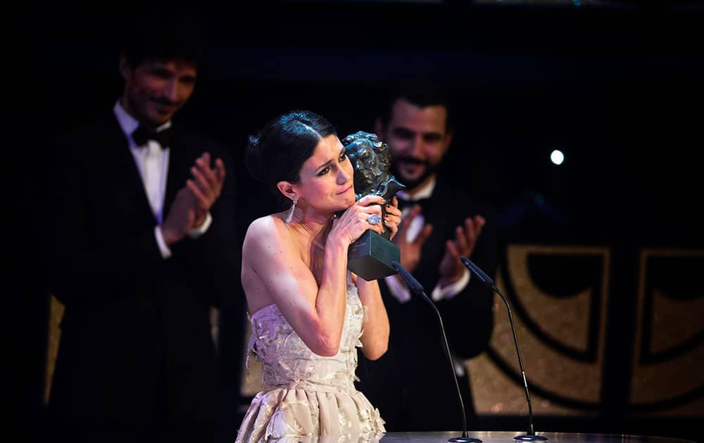 Spanish actress Nerea Barros holds her Goya trophy after winning the best new female actress award for her role in the film 'La Isla Minima' at the Goya Film Awards Ceremony in Madrid.