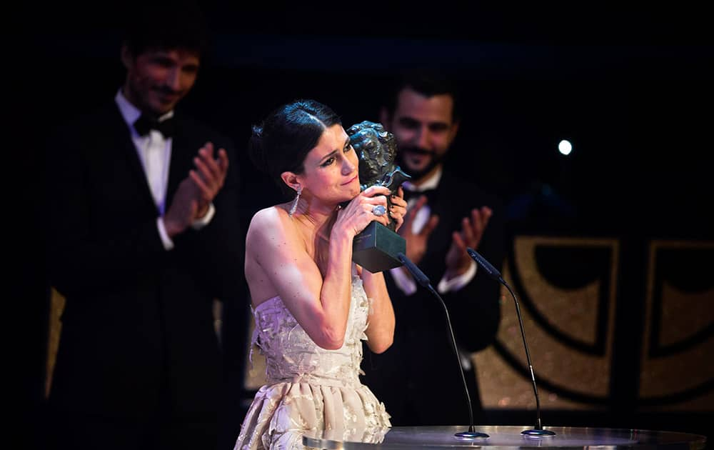 Spanish actress Nerea Barros holds her Goya trophy after winning the best new female actress award for her role in the film 'La Isla Minima' at the Goya Film Awards Ceremony in Madrid, Spain.