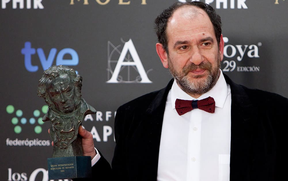 Spanish actor Karra Elejalde holds the Goya trophy after winning the best upcoming male actor category in the film 