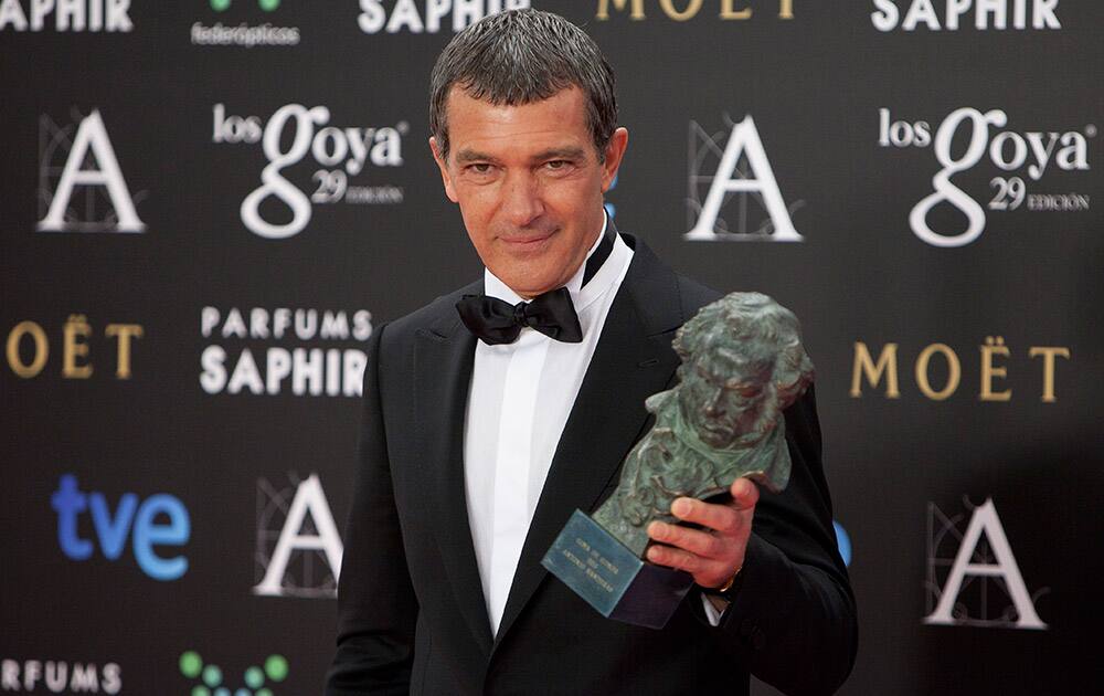 Spanish actor Antonio Banderas holds the trophy after winning the Goya of Honor at the Goya Film Awards Ceremony in Madrid, Spain.