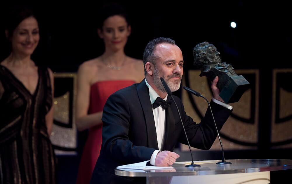 Spanish actor Javier Gutierrez holds his Goya award trophy after winning the best male actor award for his role in the film 'La isla Minima' at the Goya Film Awards Ceremony in Madrid, Spain.