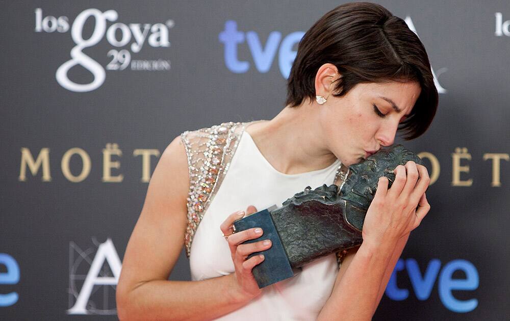 Spanish actress Barbara Lennie holds and kisses her Goya trophy after winning the best female actress award for her role in the film 