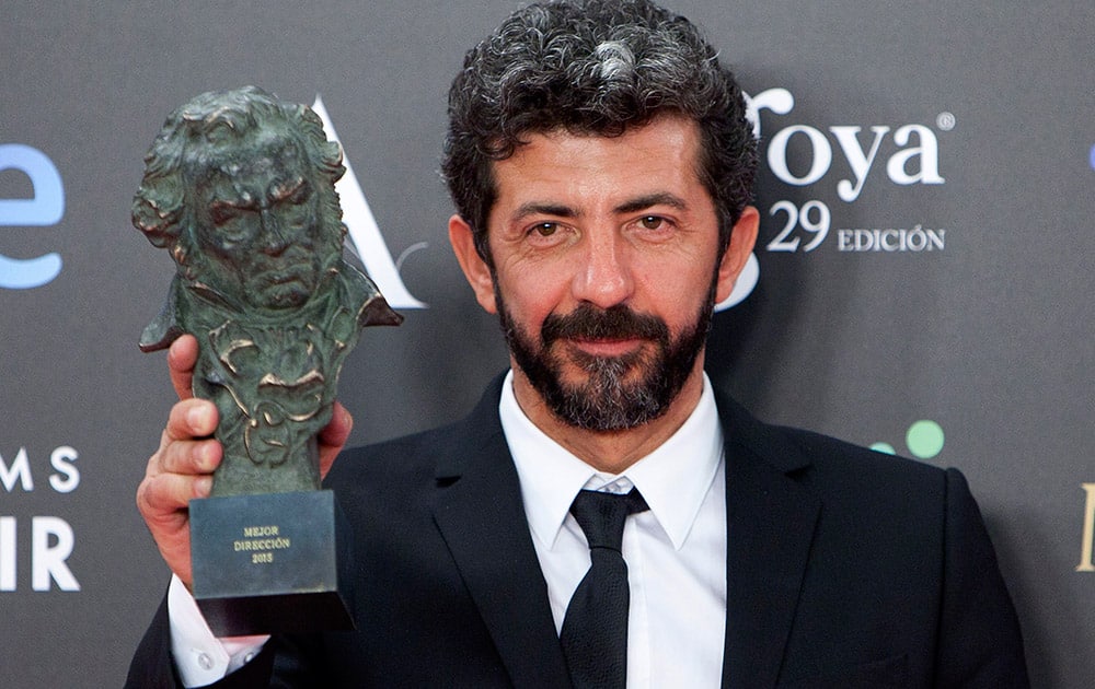 Spanish director Alberto Rodriguez holds his Goya trophy after winning the best director award by the film 