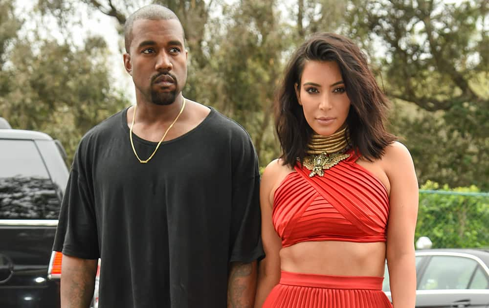 Kanye West and Kim Kardashian arrive at the Roc Nation Pre-Grammy Brunch at RocNation Offices in Beverly Hills, Calif. 