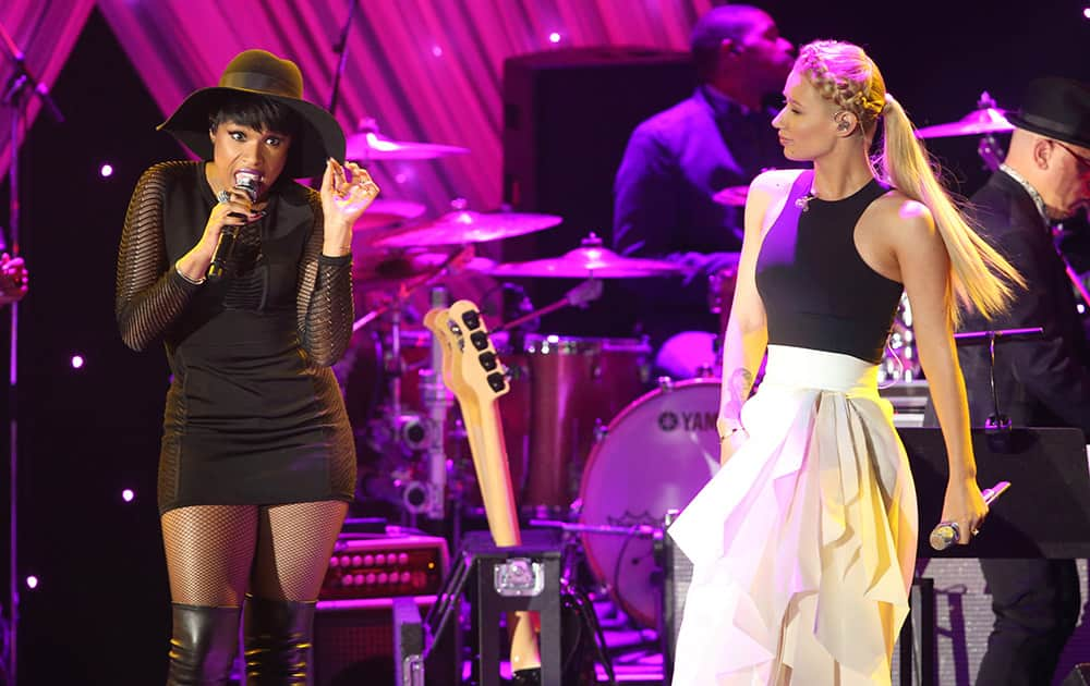 Jennifer Hudson, left, and Iggy Azalea perform at the 2015 Clive Davis Pre-Grammy Gala show at the Beverly Hilton Hotel .