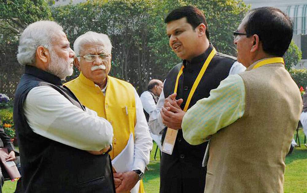 Prime Minister Narendra Modi, Haryana CM ML Khattar, Maharashtra CM Devendra Fadnavis and Madhya Pradesh CM Shivraj Chauhan during the first meeting of Governing Council of NITI Aayog in New Delhi.