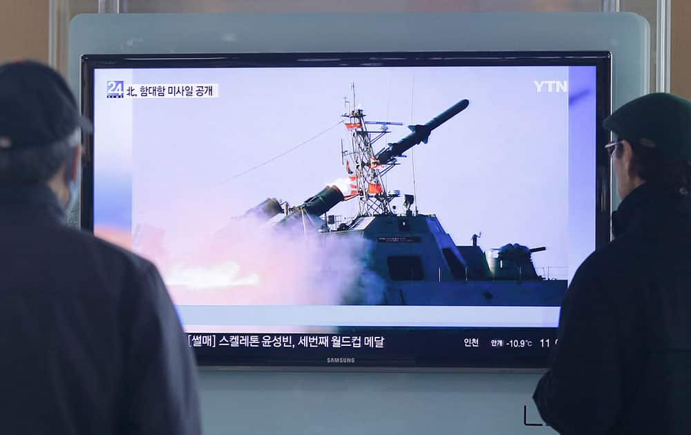 South Korean men watch a TV news program on the launch of North Korea's new anti-ship cruise missile, at Seoul train station in Seoul, South Korea.