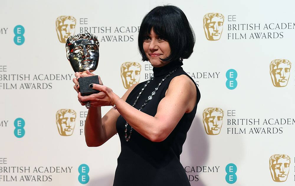 Sammy Sheldon Differ, winner of Best Costume Design for The Imitation Game poses for photographers in the winners room, during the British Academy Film and Television Awards 2015.