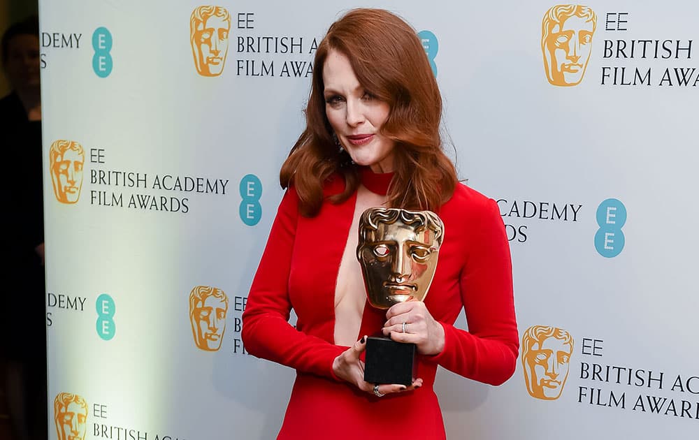 Julianne Moore, winner of Best Actress for Still Alice poses for photographers at the British Academy Film and Television Awards 2015.