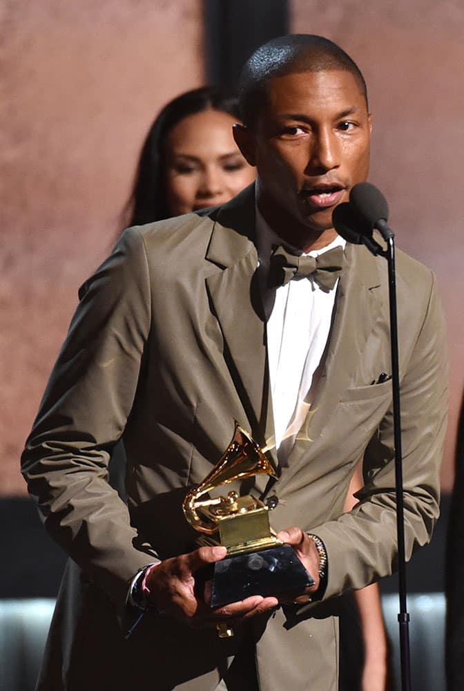 Pharrell Williams accepts the award for best pop solo performance for “Happy” at the 57th annual Grammy Awards.