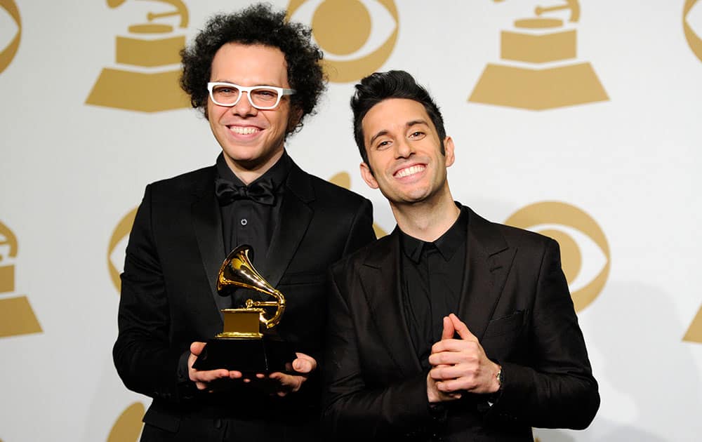 Ian Axel, left, and Chad Vaccarino, of A Great Big World pose in the press room with the award for best pop duo/group performance for “Say Something” at the 57th annual Grammy Awards.