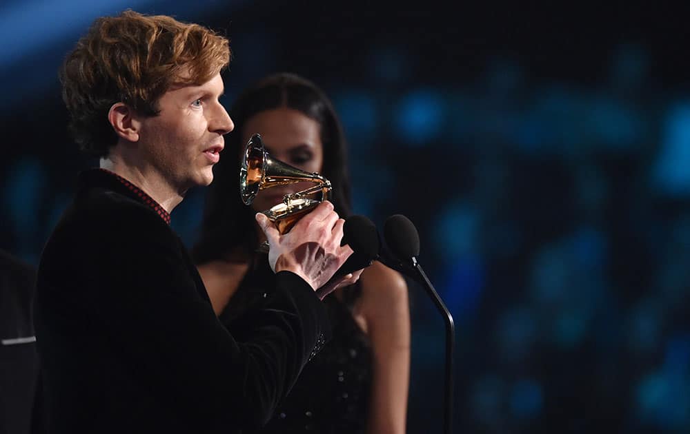 Beck accepts the award for best rock album for “Morning Phase” at the 57th annual Grammy Awards.