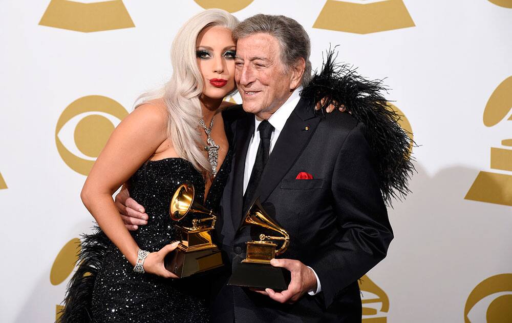 Lady Gaga and Tony Bennett pose in the press room with the award for best traditional pop vocal album for 