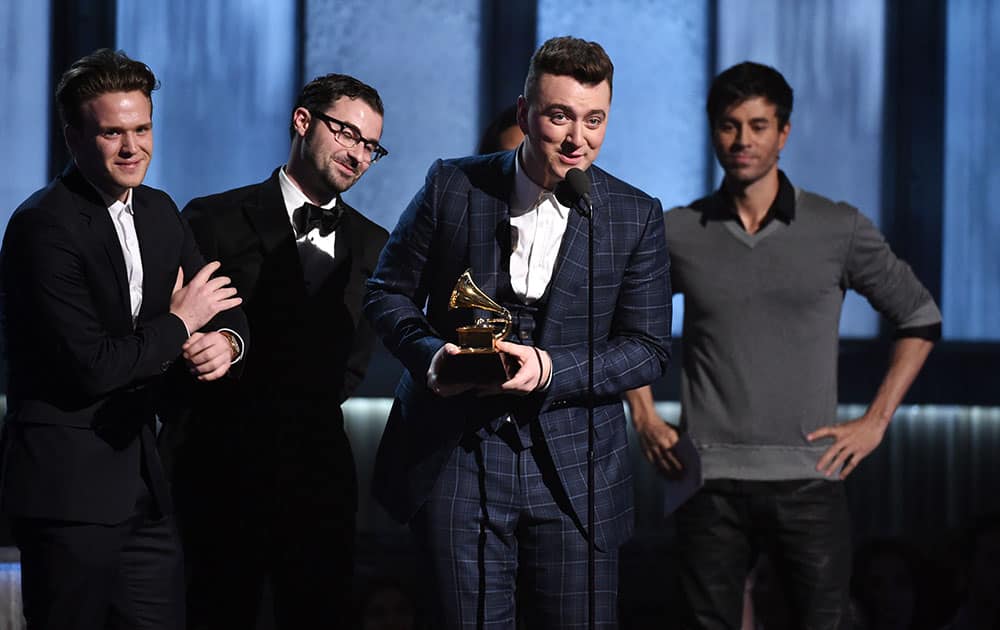 William Phillips, from left, James Napier and Sam Smith accept the award for song of the year for “Stay With Me” at the 57th annual Grammy Awards.