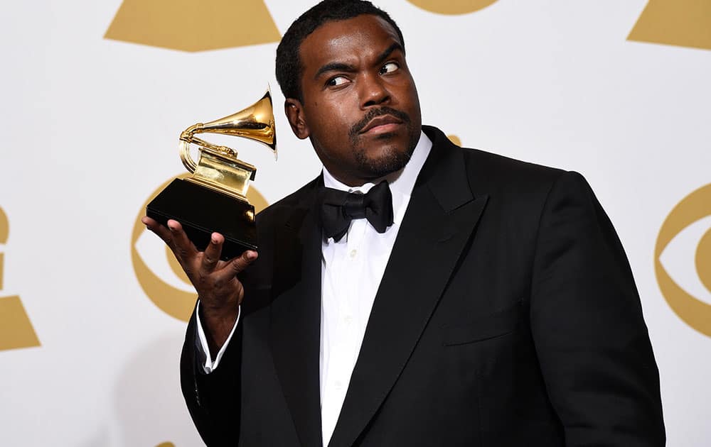 Rodney Jerkins poses in the press room with the award for record of the year for 