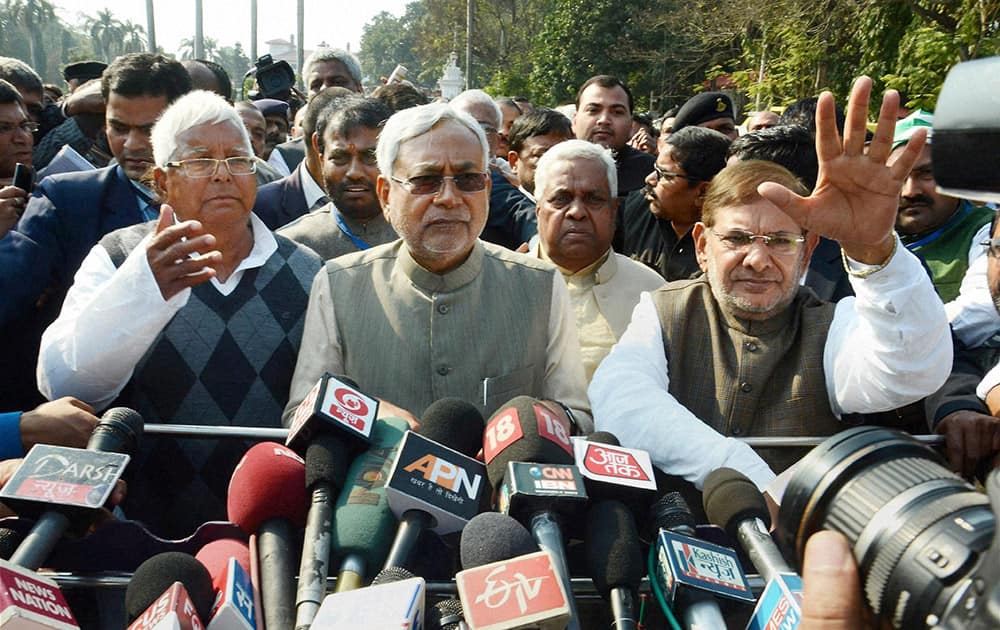 RJD chief Lalu Prasad, JD(U) senior leader Nitish Kumar and JD(U) president Sharad Yadav addressing media after meeting Bihar Governor Keshari Nath Tripathi, outside the Raj Bhawan in Patna.