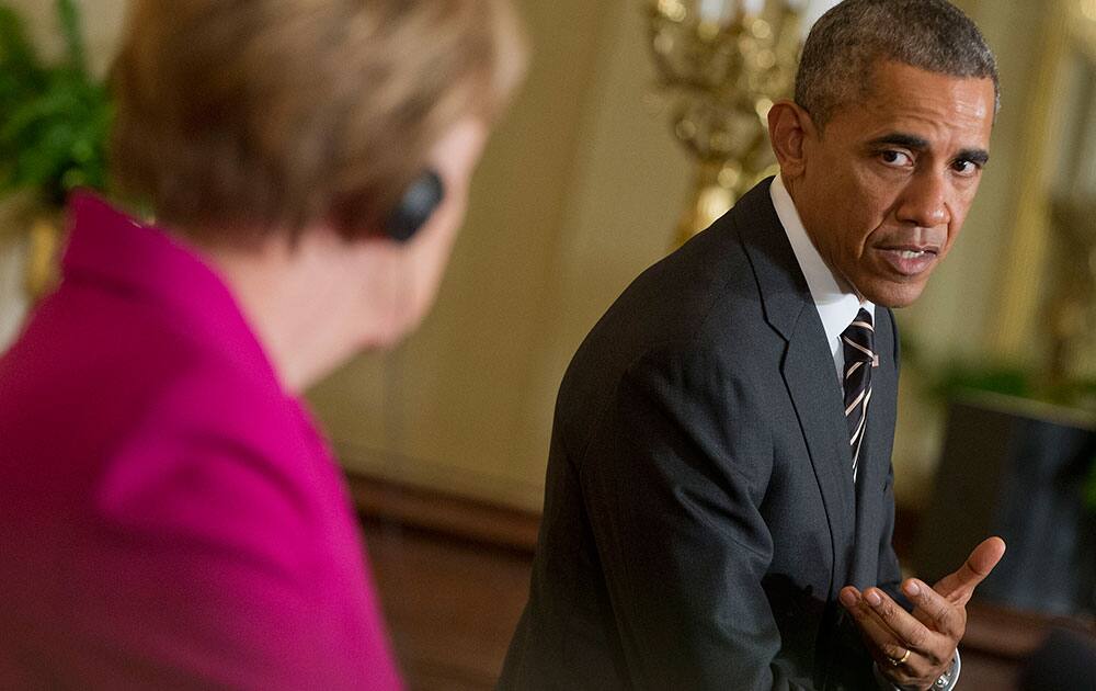 President Barack Obama and German Chancellor Angela Merkel participate in a joint news conference in the East Room of the White House in Washington.