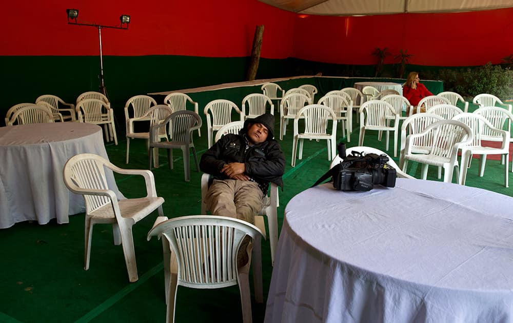 A cameraman rests at the deserted state headquarters of the Bharatiya Janata Party (BJP) in New Delhi.