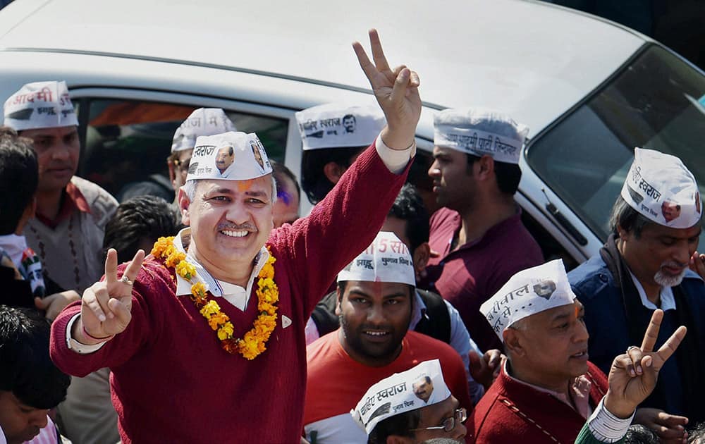 AAP leader Manish Sisodia celebrate with supporters during a victory rally after his win in the Delhi Assembly polls, in New Delhi.