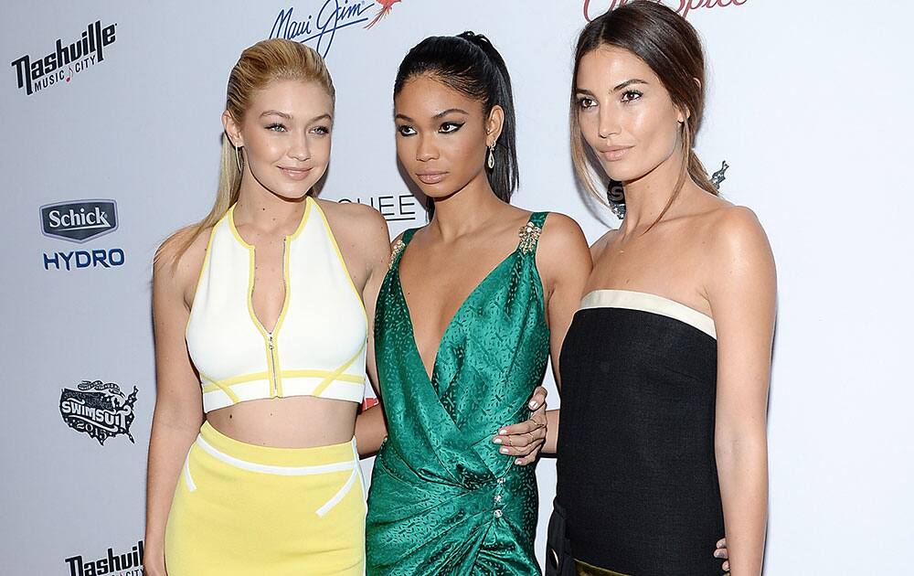 Model Gigi Hadid, from left, Chanel Iman and Lily Aldridge attend the Sports Illustrated's Swimsuit Issue 2015 Celebration at Marquee In New York.