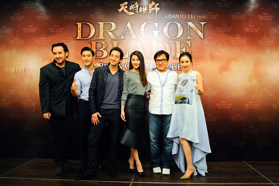 The cast of Dragon Blade, John Cusack, Choi Si-Won, Adrian Brody, Lin Peng, Jackie Chan and Mika Wang pose for a group photo during a press conference to promote their new movie 'Dragon Blade' in a hotel in Kuala Lumpur, Malaysia.