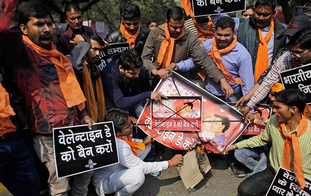 Activists of the right-winged Hindu Sena, or Hindu Army, burn posters promoting Valentines Day, during a protest in New Delhi.