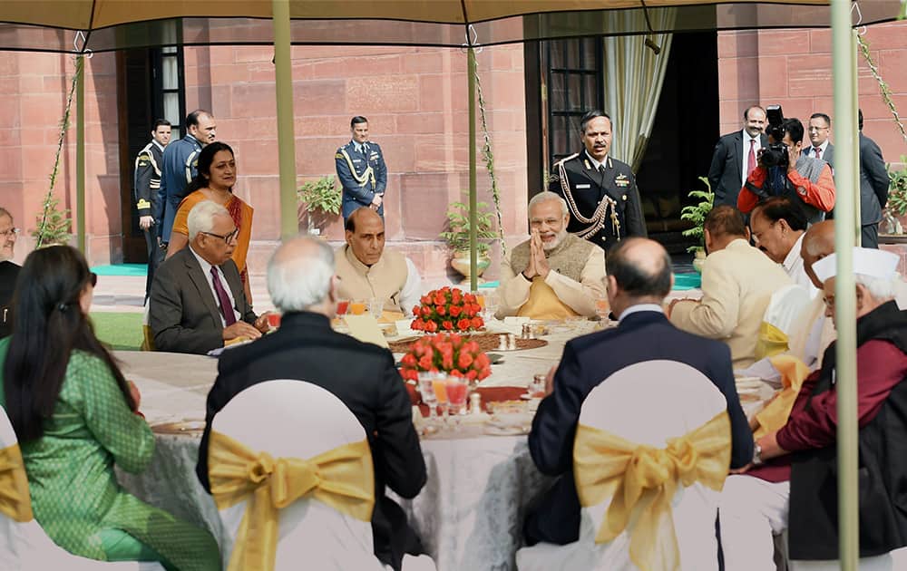 Prime Minister Narendra Modi and Home Minister Rajnath Singh during a lunch hosted for the Governors attending the 46th Governors Conference, at the Rashtrapati Bhavan in New Delhi.