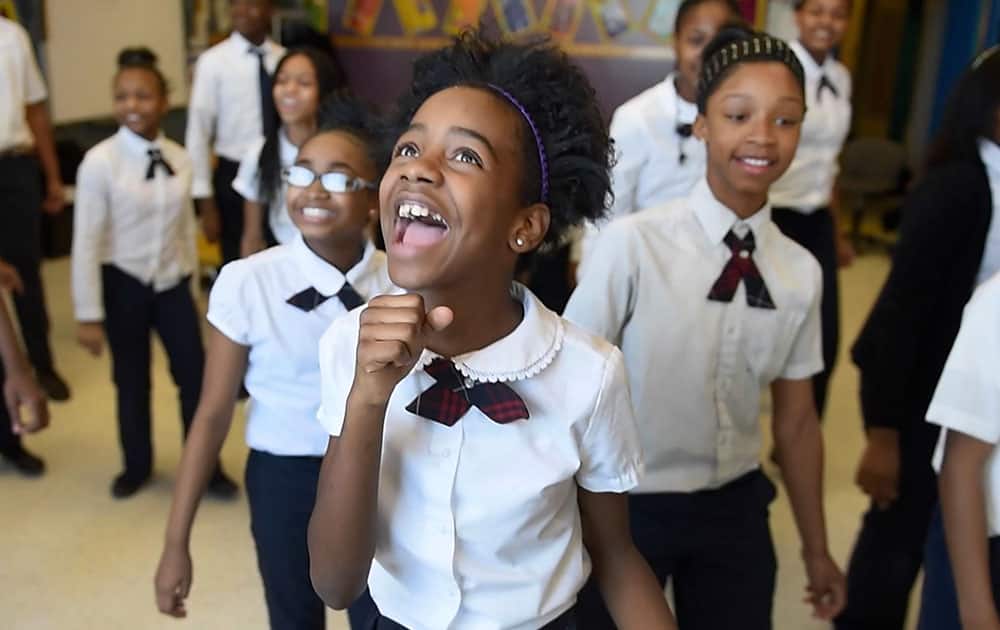Asia Newson, 11, sings during DAAS’ choir practice on Jan. 26, 2015 in Detroit. At 11 years old, Asia is the owner and CEO of Super Business Girl, a hand-crafted candle-making company in Detroit.