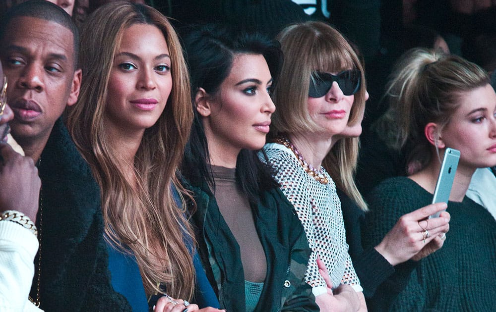 Jay-Z, from left, Beyonce, Kim Kardashian, and Anna Wintour appear at the showing of Kanye West's Yeezy Boost shoe line for Adidas, during Fashion Week in New York. 