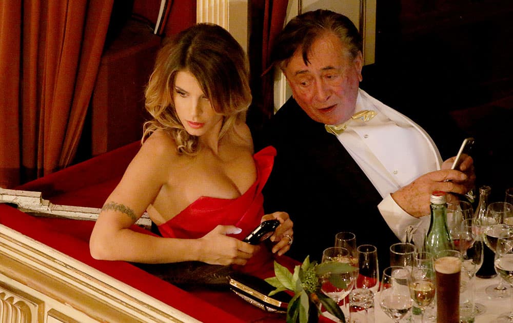 Italian actress Elisabetta Canalis and her host Austrian businessman Richard Lugner, watch the as the traditional Opera Ball gets underway in Vienna, Austria.