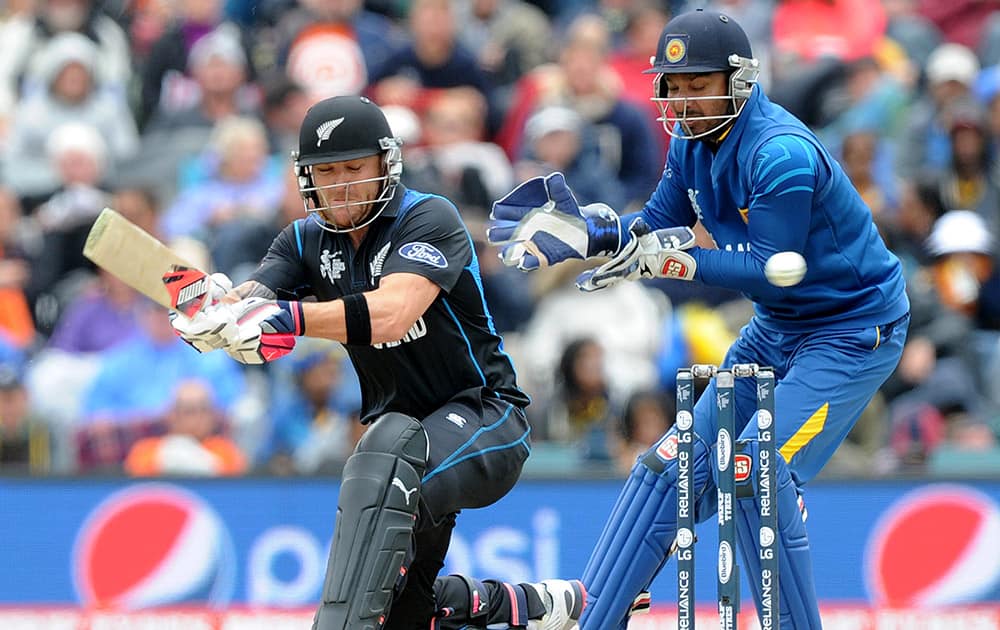 New Zealand's Brendon McCullum, sweeps the ball in front of Sri Lanka's Kumar Sangakkara during the opening match of the Cricket World Cup at Christchurch, New Zealand.