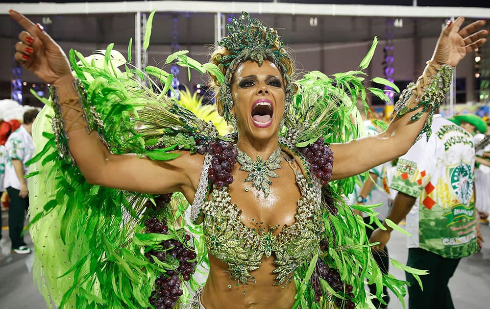 A dancer from the Mancha Verde samba school performs in the Carnival parade at the Sambodromo in Sao Paulo, Brazil.