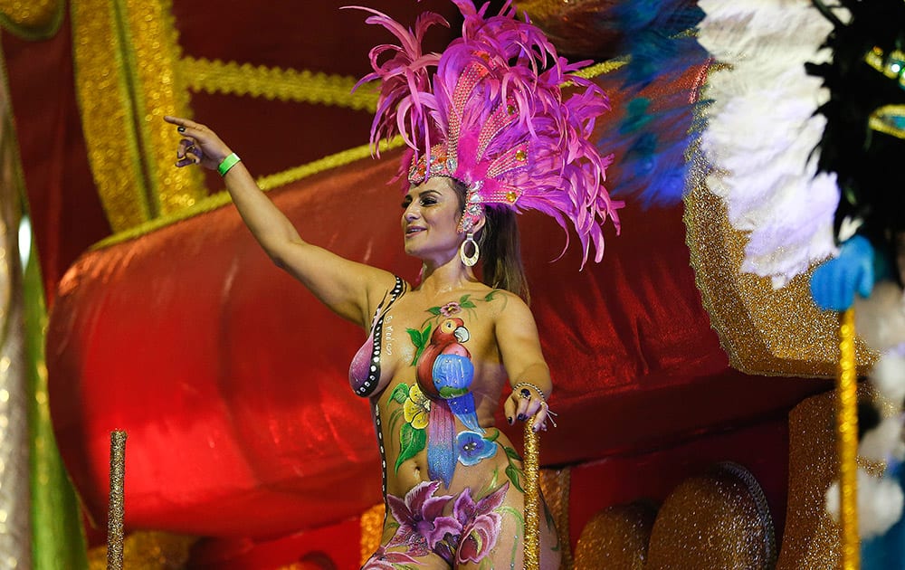 A dancer from the Academicos do Tucuruvi samba school performs during a carnival parade in Sao Paulo, Brazil.