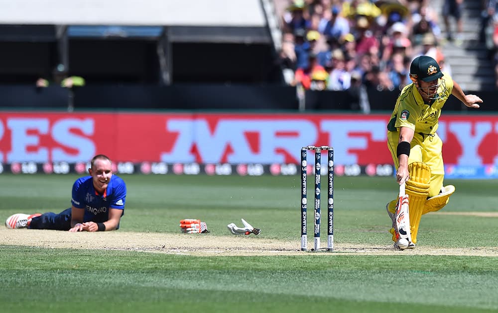 England bowler Stuart Broad, watches as Australia batsman David Warner runs to his crease after they collided midwicket during their cricket world cup pool A match in Melbourne.