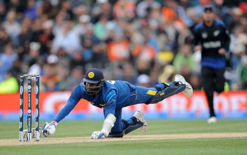 Sri Lanka's Angelo Mathews dives to avoid a run out against New Zealand during the opening match of the Cricket World Cup at Christchurch, New Zealand.