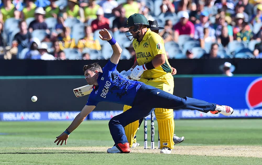 Australia's Aaron Finch watches as England's James Anderson dives to stop a ball during their Cricket World Cup pool A match in Melbourne, Australia, Saturday.