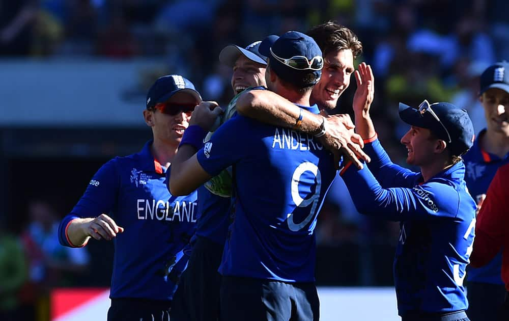 England's Steven Finn embraces James Anderson after taking the wicket of Australia's Mitchell Johnson during their Cricket World Cup pool A match in Melbourne, Australia.