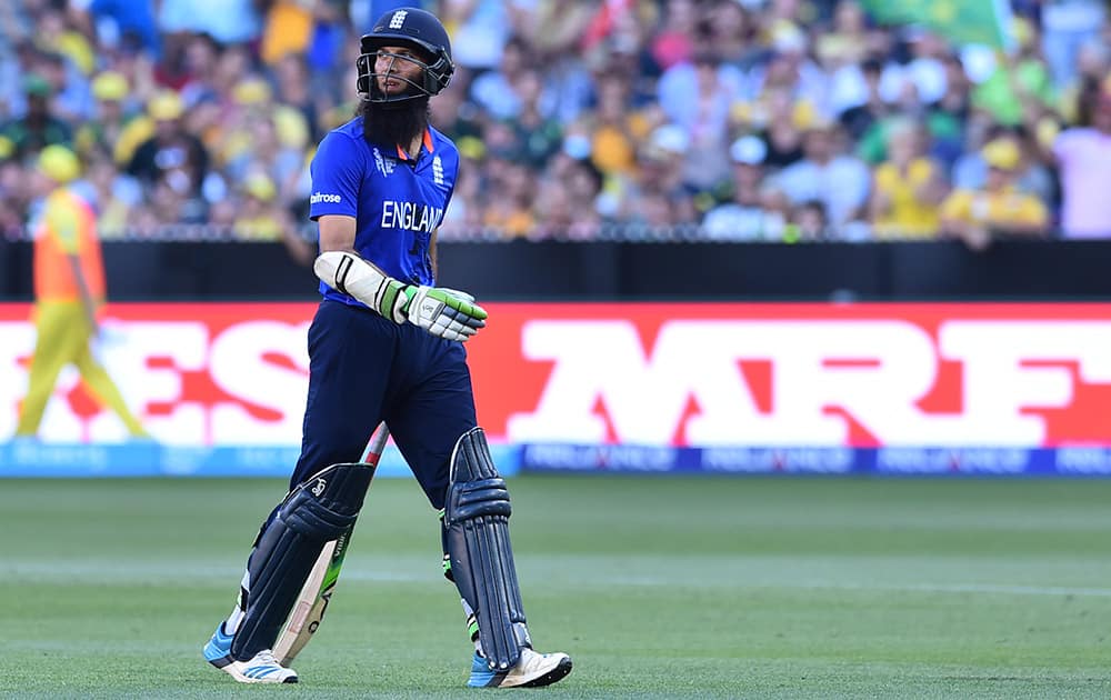 England's Moeen Ali walks off the field after his wicket was taken during their Cricket World Cup pool A match against Australia in Melbourne, Australia.