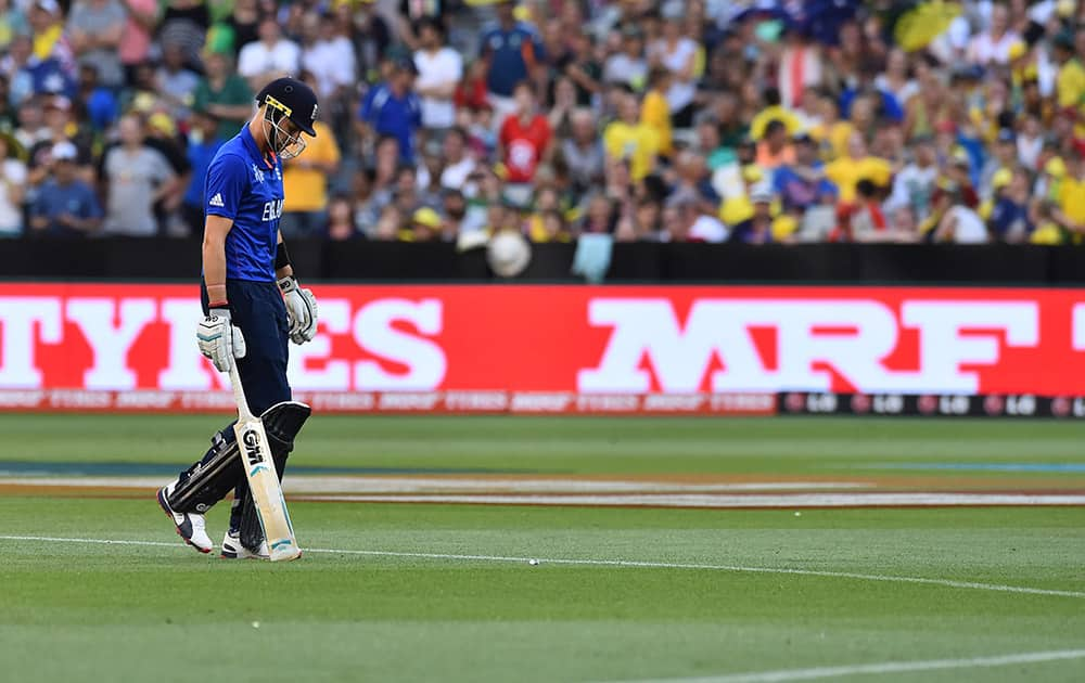 England's Joe Root walks off the field after his wicket fell during their Cricket World Cup pool A match against Australia in Melbourne, Australia.