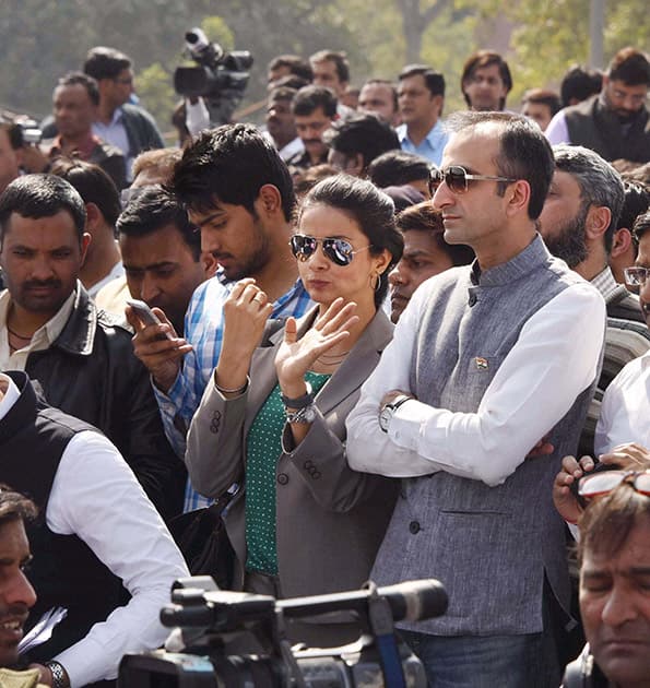 AAP leaders Gul Panag and Rahul Mehra at Delhi CM Arvind Kejriwals swearing-in ceremony at Ramlila Maidan in New Delhi.