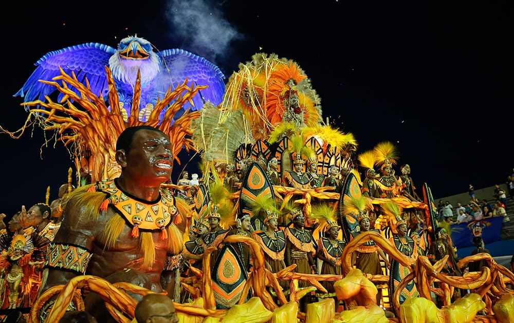 Dancers from the Nene de Vila Matilde samba school perform on a float during a carnival parade in Sao Paulo.