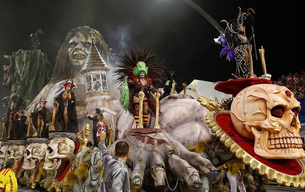 Dancers from the Tom Maior samba school perform on a float during the Carnival parade at the Sambodromo in Sao Paulo, Brazil.