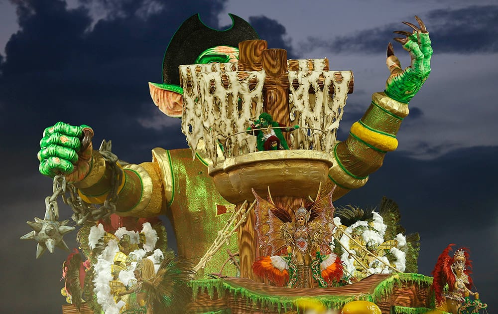 Dancers from the Nene de Vila Matilde samba school perform on a float during a carnival parade in Sao Paulo, Brazil.